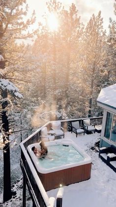 a hot tub sitting on top of a snow covered hillside