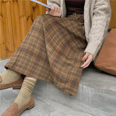 Details: Long plaid skirt with high-waist design Skirt Length: Long Materials:95% Polyester + 5% Spandex Plaid Mini Skirt For Fall, Plaid Lined Skirt For Winter, Plaid Midi Skirt For Fall, Fall Plaid Mini Skirt, Plaid Midi Skirt Casual Style, Casual Plaid Midi Skirt, Fall Plaid Relaxed Fit Skirt, Casual Plaid Winter Skirt, Casual Plaid Skirt For Winter