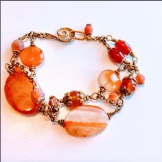 This Brand New Handcrafted Bracelet Is Beautiful! There Are Orange Carnelian Gemstone Beads And Gold Accents That Have Been Wire Wrapped Together. Measures 8 3/4 Inches Long. I Can’t Change The Length On This Bracelet. Comes With Organza Gift Bag. Healing Carnelian Beaded Bracelets, Adjustable Carnelian Beaded Bracelets, Handmade Carnelian Round Bead Bracelets, Handmade Orange Agate Beaded Bracelets, Handmade Carnelian Bracelets, Bohemian Carnelian Bracelet In Orange, Bohemian Orange Carnelian Bracelet, Adjustable Carnelian Beaded Bracelets With Gemstone Beads, Adjustable Orange Gemstone Bracelets