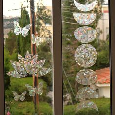 the window is decorated with many different shapes and sizes, including butterflies on it's side