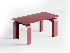 a red table sitting on top of a white floor next to a pink bench with two legs