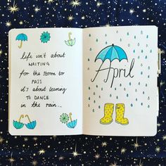 an open book with rain boots and umbrellas written on the pages, in front of stars