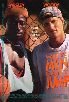 two men standing next to each other in front of a fence with the words white men can't jump on it