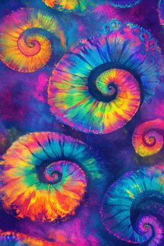 an image of colorful spirals in the air with watercolor paint on it's surface