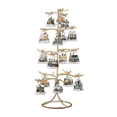 a christmas tree with many ornaments hanging from it's sides and on top of each other