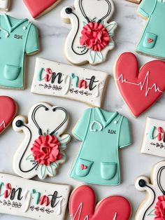 decorated cookies are arranged on a table with stethoscopes and medical symbols