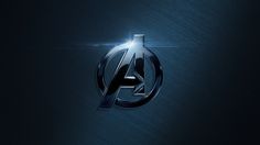 the avengers logo is shown on a dark blue background with light coming from behind it