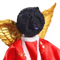 a black dog wearing a red jacket and gold angel wings