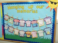 a bulletin board with clothes hanging up on the clothesline and sun in the background