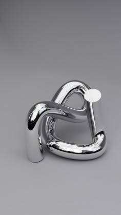 a silver object that is shaped like a letter