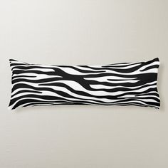 a black and white zebra print pillow on a wall