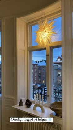 a window sill with a lit candle on it