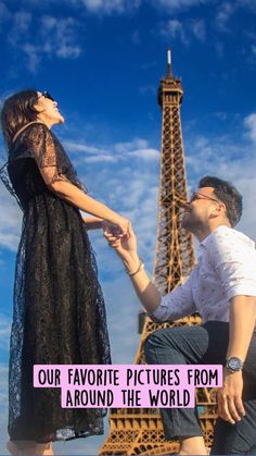 a man kneeling down next to a woman in front of the eiffel tower