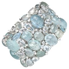 A multi stone aquamarine bracelet, made by Moira, set with mixed cuts of faceted and cabochon aquamarines, weighing an estimated 369.00ct, and round brilliant-cut diamonds weighing an estimated 0.91ct, mounted in 18ct white gold. With a push-in tongue and box clasp. Diamond Gold Bracelet, White Gold Drop Earrings, Jewel Design, Clay Silver, Gold Heart Bracelet, Platinum Bracelet, Retro Bracelet, Aquamarine Bracelet, Geometric Bracelet