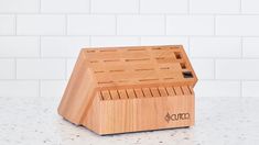 a small wooden box that is sitting on a counter top with the word conco printed on it