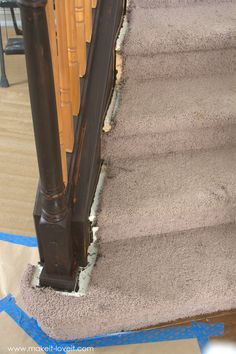 the carpet on the stairs has been ripped off and is still attached to the railing