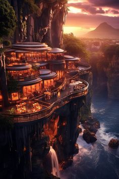 an aerial view of a cliff side restaurant on the edge of a body of water