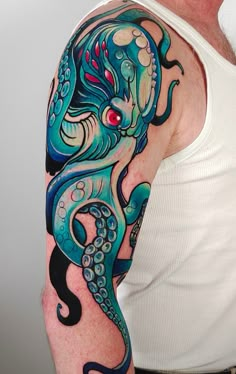 an octopus tattoo on the arm and shoulder