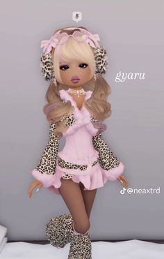 a very cute looking doll with big hair and leopard print on it's clothes