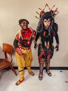 two people in costumes standing next to each other