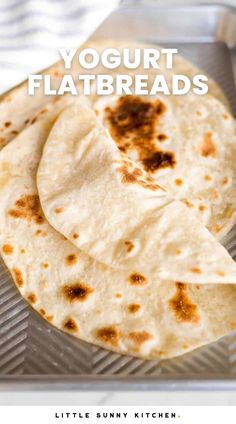 three flatbreads sitting on top of a pan with the words yogurt flatbreads