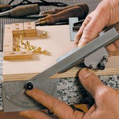 a man is using a large pair of scissors to cut wood with a viset