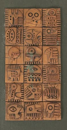 an art work made out of wood with different shapes and sizes on the side of it