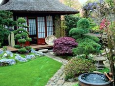 a japanese garden with rocks and grass