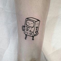 a small black and white drawing of a toaster on the leg