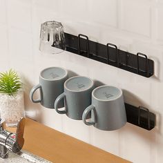 PRICES MAY VARY. 【No Drilling & Easy to Install】mug holder comes with heavy duty self-adhesive adhesive. Just stick the adhesive on the surface and fix the mug rack above it.Note that the non-marking sticker is aligned with the nail hole and then fixed. No need to drill your wall, will never damage your wall(Of course, if you want, you can also choose to use our configured screws for drilling installation). 【Storage+Moisture-proof】Our cup holder adopts wall-mounted storage, and the cup is buckled upside down on the cup holder, which can not only realize storage, but also allow the cup to be ventilated and drained, prevent moisture,save space, and be more convenient to use. 【Good Loading Capacity】 This Mug Rack is Made of Good Quality Metal with Paint Sprayed, Anti-rust, Maximum Load Weight Mug Hooks, Mug Holder, Mug Rack, Kitchen Living Room, Kitchen Living, Living Room Office, Room Office, Cup Holder, Coffee Cups