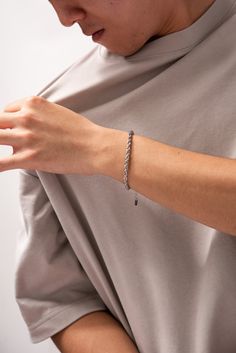 Description Need a minimal yet sleek touch to your overall outfit? Look no further as this stainless steel rope bracelet will do just that! Effortlessly charming and undeniably you! Perfect for casual day-to-day wear, or even a semi-formal look. Size Length: 7.25 in (18.42 cm) Width: 0.15 in (0.38 cm) Extension: 1.75 in (4.45 cm) Quality Made with premium stainless steel, our twisted rope chain bracelet won’t break or tarnish. The bracelet is also fitted with durable lobster claw clasps that fas Silver Rope Bracelet, Overall Outfit, Expensive Jewelry Luxury, Halo Design, Silver Chain Bracelet, Jewelry Luxury, Expensive Jewelry, Mens Accessories Jewelry, Outfit Look