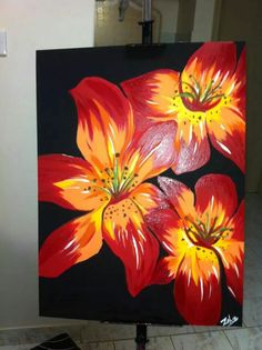 a painting of red and yellow flowers on a black background