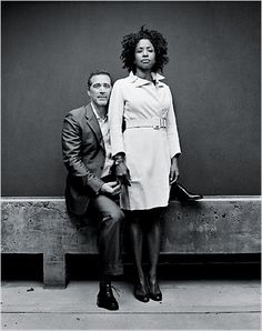 black and white photograph of two people sitting on a bench