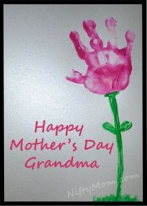 an image of a handprinted pink flower on a greeting card for mother's day