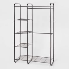 an iron rack with three shelves on each side and one shelf in the middle, against a white background