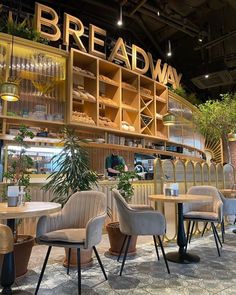 the interior of a bread shop with tables and chairs