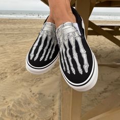 These custom Vans Slip On Shoes have been customized with skeleton bones of your feet. Perfect for the Horror Scary Movie fan and especially getting ready for Halloween this October. These Vans shoes have canvas uppers. Vulcanized waffle rubber outsoles. For Men and Women. Designed by Blake Barash. We buy each pair of shoes BRAND NEW. Each pair is made to order, please make sure you put in the correct shoe size before you check out. The ink is permanent and will never come off, fade away, or pee Daily Dress Casual, Custom Vans Slip On, Custom Slip On Vans, Beach Toes, Vans Slip On Shoes, Platform Shoes Heels, Timeless Classic Style, Vans Slip On, Custom Vans