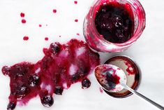 blueberry sauce in a jar and spoon next to it