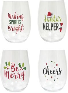 four wine glasses with different sayings on the bottom one says, making spirits bright and the other says be merry