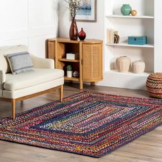 a living room filled with furniture and a rug