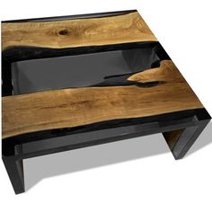 a wooden table with black metal legs and a wood slab on the top that is shaped like a boat