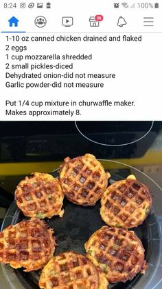 four waffles sitting on top of a black plate