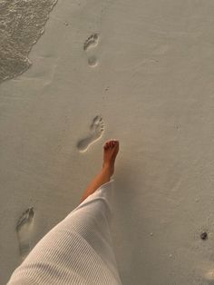 a person with their feet in the sand