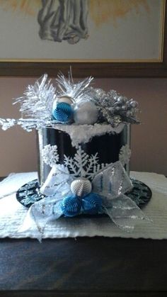 a cake decorated with blue and white decorations