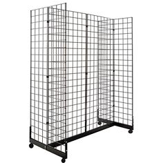 a large metal cage with wheels on it