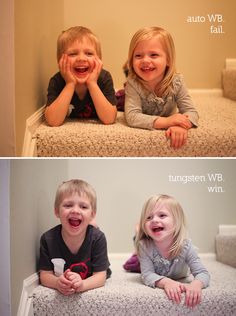 two children laying on the floor with their hands over their eyes and smiling at the camera