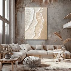 a living room filled with furniture and a large painting hanging on the wall above it