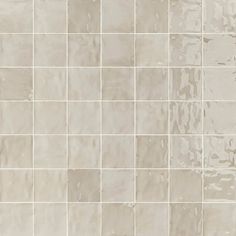 a tile wall with white and gray colors