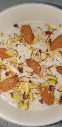 a bowl filled with yogurt and almonds