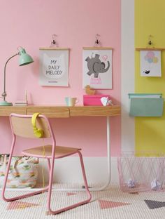 a pink desk and chair in a child's room